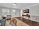 Cozy living room with neutral decor, hardwood floors, and a view of the entryway at 1331 Walker Ave, Atlanta, GA 30344
