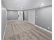 Large basement featuring neutral carpet flooring and recessed lighting throughout at 6095 Blackberry Ln, Buford, GA 30518