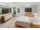 Spacious bedroom with natural light, modern décor, and wood-look flooring at 6095 Blackberry Ln, Buford, GA 30518