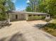 Charming one-story home featuring a carport and a well-manicured front yard at 6095 Blackberry Ln, Buford, GA 30518