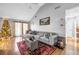 Spacious living room with vaulted ceilings, L-shaped sofa, and hardwood floors at 1367 Fairview Trl, Lawrenceville, GA 30043