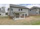 Gray house with covered patio and backyard at 4443 Eastbrook Pl, Snellville, GA 30039