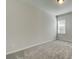 Well lit bedroom with neutral walls, carpet and a bright window at 409 West March Cir, Loganville, GA 30052