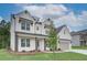 Beautiful two-story house with white painted brick, and black trim at 409 West March Cir, Loganville, GA 30052