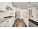 Gourmet kitchen features stainless steel appliances, granite countertops, and an island at 409 West March Cir, Loganville, GA 30052