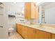 Clean bathroom with double vanity and light wood cabinets at 385 Ralph Mcgill Ne Blvd # E, Atlanta, GA 30312