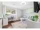 Bright home office space with a desk, sofa, and large window at 385 Ralph Mcgill Ne Blvd # E, Atlanta, GA 30312