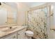 Bathroom featuring a vanity with marble countertop and shower and bath combo with decorative shower curtain at 532 Goldfinch Way, Stockbridge, GA 30281