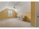 Large bonus room with vaulted ceilings, natural light, and plush carpeting, ideal for recreation or relaxation at 532 Goldfinch Way, Stockbridge, GA 30281