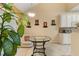 Bright breakfast nook with a glass table, natural light, and modern white cabinetry for a cozy dining experience at 532 Goldfinch Way, Stockbridge, GA 30281
