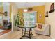 Breakfast nook with glass table and sliding door access to the outdoor area at 532 Goldfinch Way, Stockbridge, GA 30281
