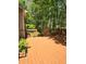 A spacious stained wooden deck overlooks a private wooded backyard with mature trees at 532 Goldfinch Way, Stockbridge, GA 30281