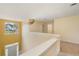 Upstairs landing overlooking the entry featuring bright, neutral decor and natural light at 532 Goldfinch Way, Stockbridge, GA 30281