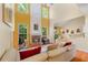 Living room featuring high ceilings, a fireplace, and an open floor plan at 532 Goldfinch Way, Stockbridge, GA 30281