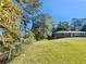 A single story brick home featuring a well-manicured lawn and mature trees at 3801 Orchard Se Rd, Smyrna, GA 30080