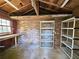 A storage shed with exposed brick, shelving units and built in table at 3801 Orchard Se Rd, Smyrna, GA 30080
