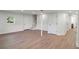 Finished basement with wood-look floors and neutral walls at 3611 Hillsborough Ln, Decatur, GA 30032