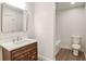 Simple bathroom with brown vanity, white countertop, and bathtub at 3611 Hillsborough Ln, Decatur, GA 30032