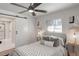 Bright bedroom with gray walls, wood floors, and barn door at 3611 Hillsborough Ln, Decatur, GA 30032