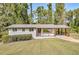 Ranch home with covered porch and landscaped lawn at 3611 Hillsborough Ln, Decatur, GA 30032