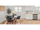 Modern kitchen with white cabinets, granite counters, and stainless steel appliances at 3611 Hillsborough Ln, Decatur, GA 30032