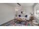 Bright living room features a comfy sofa, stylish rug, and modern lighting at 3611 Hillsborough Ln, Decatur, GA 30032
