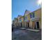 New yellow townhomes feature fiber cement siding and professionally landscaped homesites, nearing construction completion at 1095 Tucker Ave # 208, Atlanta, GA 30310