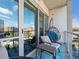 Outdoor balcony area featuring comfortable seating and a hanging chair with city views at 1100 Howell Mill Rd # 404, Atlanta, GA 30318