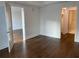 Bedroom showcasing hardwood flooring with white walls and multiple entryways at 1100 Howell Mill Rd # 404, Atlanta, GA 30318