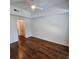 Spacious bedroom featuring hardwood flooring, white walls, and a ceiling fan at 1100 Howell Mill Rd # 404, Atlanta, GA 30318