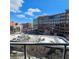 Exterior view from a balcony of a sunny, mixed-use urban development, including retail at 1100 Howell Mill Rd # 404, Atlanta, GA 30318