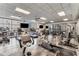 Well-equipped gym with treadmills, weights, machines, and large windows overlooking a patio at 1100 Howell Mill Rd # 404, Atlanta, GA 30318