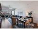 Open living and dining area with stylish furnishings, bright light, and hardwood floors at 1100 Howell Mill Rd # 404, Atlanta, GA 30318