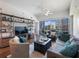 Cozy living room featuring a ceiling fan, balcony access, and stylish furniture at 1100 Howell Mill Rd # 404, Atlanta, GA 30318