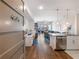 Bright open-concept living space boasts a modern kitchen and dining area with hardwood floors at 1100 Howell Mill Rd # 404, Atlanta, GA 30318