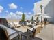 Outdoor seating area with comfortable chairs, tables, and umbrellas, perfect for relaxing and entertaining at 1100 Howell Mill Rd # 404, Atlanta, GA 30318