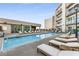 Rooftop pool surrounded by loungers, offering a relaxing outdoor space with city views at 1100 Howell Mill Rd # 404, Atlanta, GA 30318