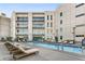 Rooftop pool with lounge chairs offering a luxurious outdoor living space with city views at 1100 Howell Mill Rd # 404, Atlanta, GA 30318