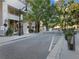 Charming street view with lush trees, a retail store facade, and well-maintained sidewalks at 1100 Howell Mill Rd # 404, Atlanta, GA 30318