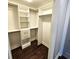 Spacious walk-in closet featuring custom shelving, drawers, and rods for optimal organization and storage at 1100 Howell Mill Rd # 404, Atlanta, GA 30318