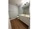 Updated bathroom with vanity, toilet, and wood-look vinyl floor at 2805 Vining Ridge Ter, Decatur, GA 30034
