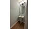 Powder room with pedestal sink and oval mirror at 2805 Vining Ridge Ter, Decatur, GA 30034