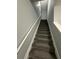 Gray carpeted staircase with white railing at 2805 Vining Ridge Ter, Decatur, GA 30034
