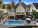 The backyard features a beautiful pool, patio area, and a unique spiral staircase at 6308 Woodlake Dr, Buford, GA 30518