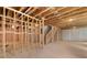 Unfinished basement ready for customization, showcasing the framing and essential structural components at 7530 Homer Dr, Cumming, GA 30028
