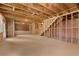 Spacious unfinished basement with visible framework, stairs, and plenty of potential for customization at 7530 Homer Dr, Cumming, GA 30028