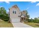 Stylish two-story home featuring mixed siding, brick accents, and a well-maintained lawn in a serene setting at 7530 Homer Dr, Cumming, GA 30028