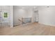 Bright loft area featuring hardwood floors, a staircase, and trim at 7530 Homer Dr, Cumming, GA 30028