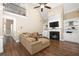 Two-story living room with hardwood floors, fireplace, and high ceilings at 1486 Sylvan Ne Cir, Brookhaven, GA 30319