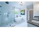 Bright and modern bathroom features a glass walk-in shower, soaking tub, granite countertop, and double sink vanity at 1709 Eastside Parc St, Atlanta, GA 30316